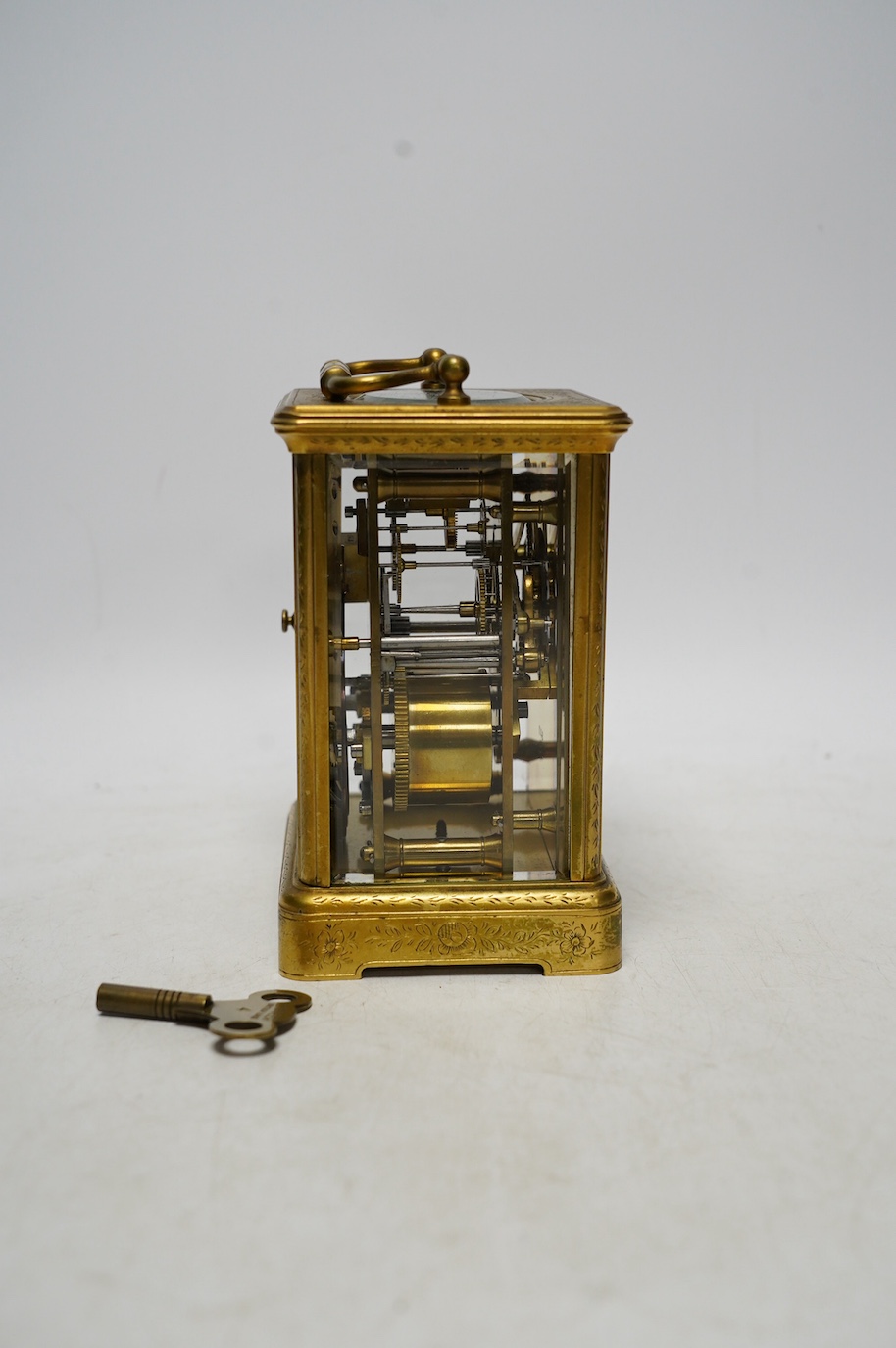 An engraved brass carriage clock by Richard & Cie, serial number 648, with key, 14cm. Condition - fair, dial cracked. Not tested as working